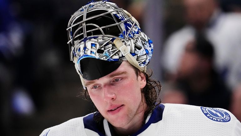 Tampa Bay Lightning goaltender Andrei Vasilevskiy pauses during a break...