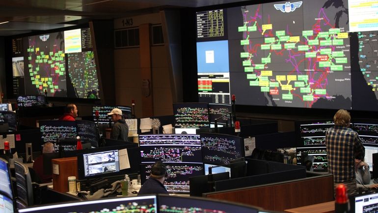 Union Pacific dispatchers keep track of trains moving across the...