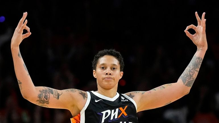 Phoenix Mercury center Brittney Griner (42) celebrates her three-pointer against...