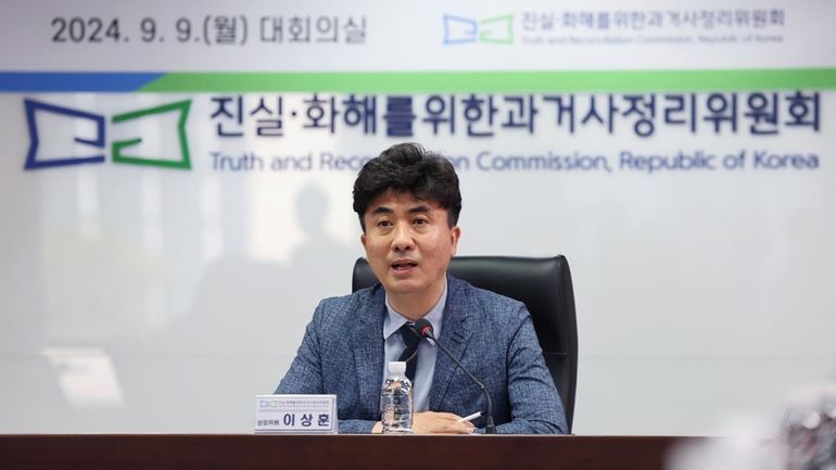 Lee Sang Hoon, a standing commissioner, speaks to the media...