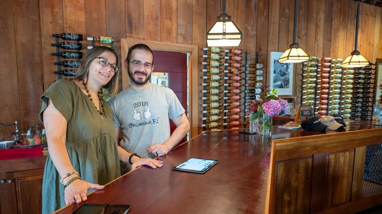 Toni Sabatini, left, and Harry Torres enjoy a day at...