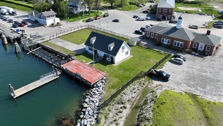 This Fishers Island property, once a U.S. Coast Guard housing...