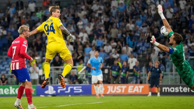 Lazio's goalkeeper Ivan Provedel, second from left, scores his side's...