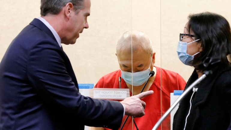 Chunli Zhao, center, appears for a plea hearing with his...