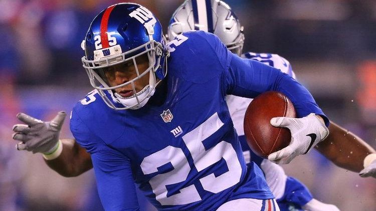 Leon Hall of the New York Giants runs with the...