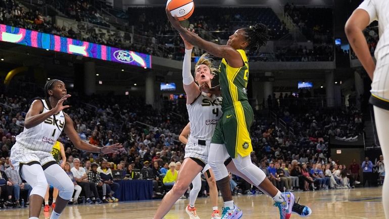 Chicago Sky guard Marina Mabrey, left, fouls Seattle Storm guard...