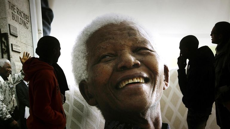 File — A photo of former South African President Nelson...