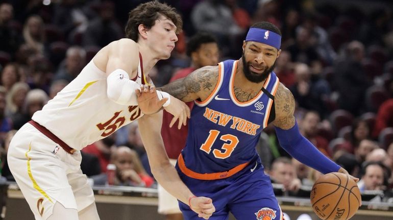 The Knicks' Marcus Morris Sr. drives to the basket against the...