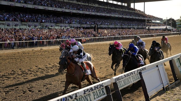 Sir Winston (7), with jockey Joel Rosario up, crosses the...