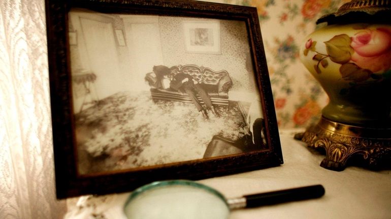 A crime scene photograph of Lizzie Borden's father, Andrew Borden,...