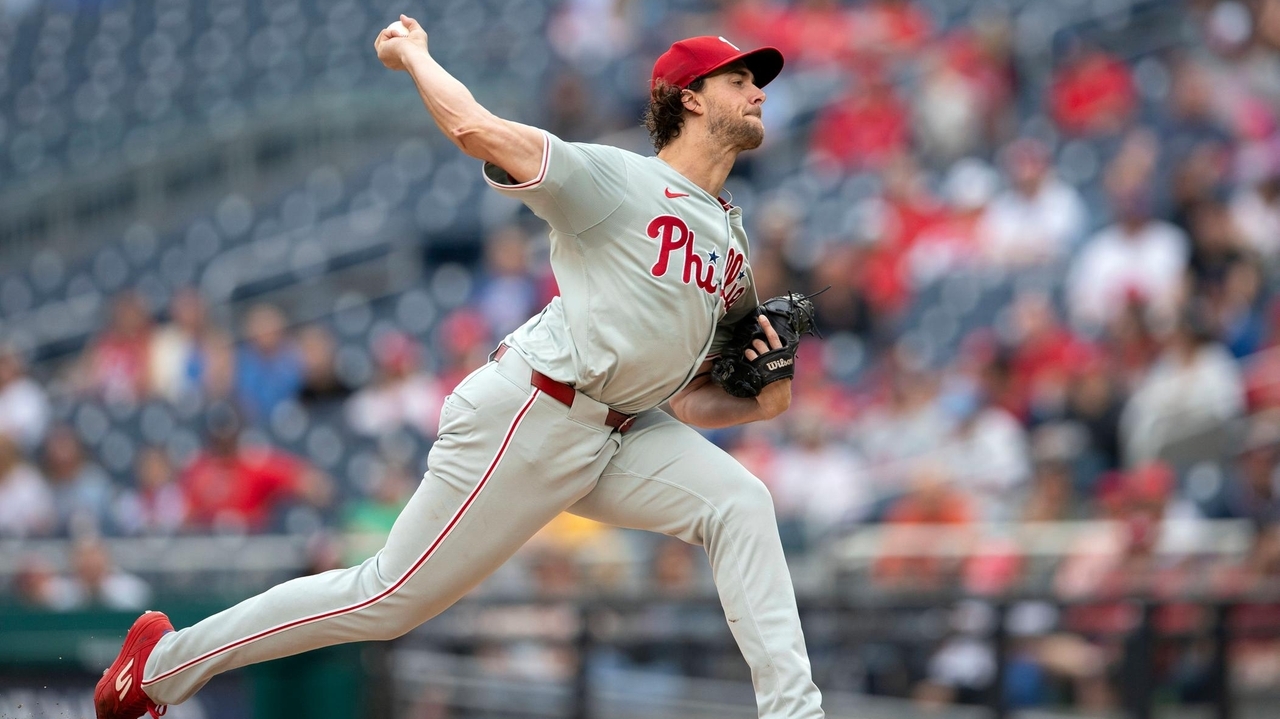 Nola earns 14th victory as NL East champion Phillies beat the Nationals