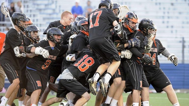 Babylon celebrates their championship win against Locust Valley in the...