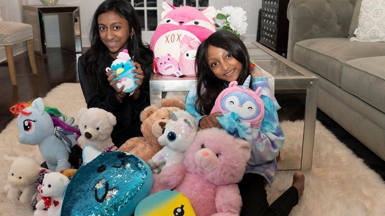 Arianna Gevarghese, 13, left, and her sister Isabella Gevarghese, 10,...