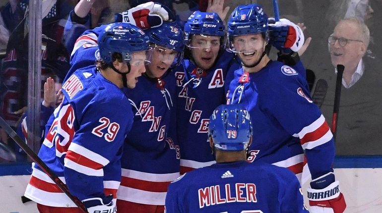 Rangers celebrate a goal by center Ryan Strome against the...