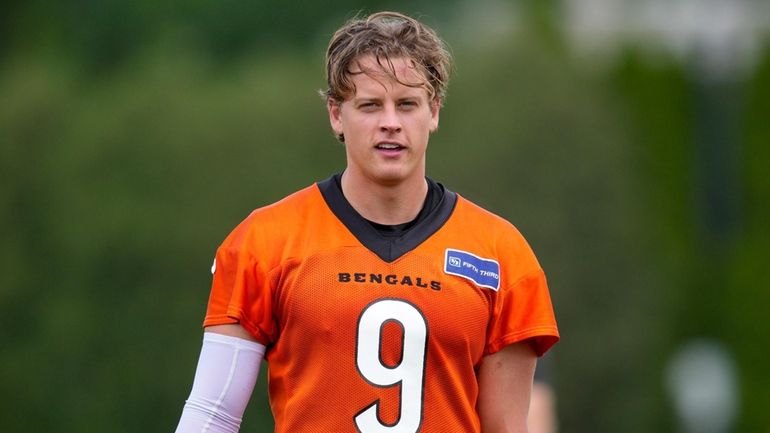 Cincinnati Bengals quarterback Joe Burrow walks off of the field...