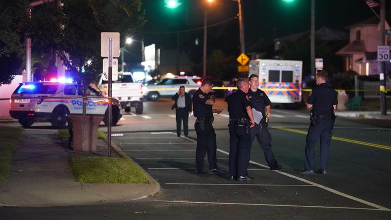 Nassau County police at the scene in Island Park where...