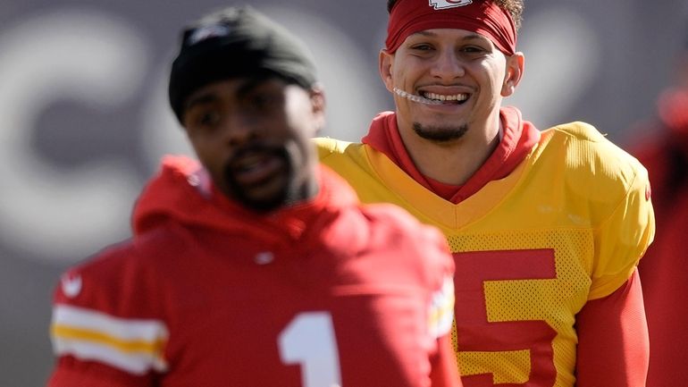 Kansas City Chiefs quarterback Patrick Mahomes, right, and running back...