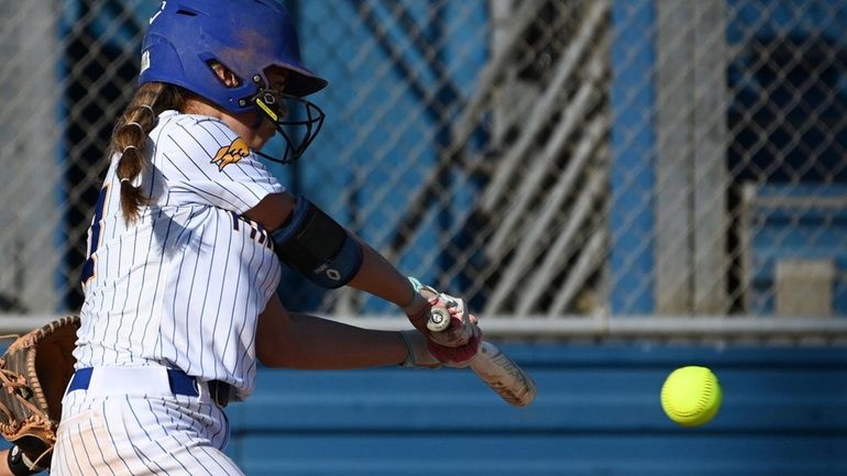 Lexi Zaremba #10 of Kellenberg plates a run with a...