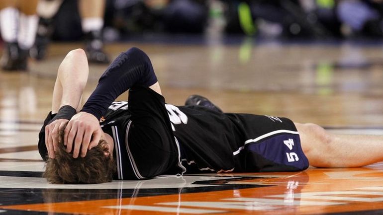 Butler's Matt Howard reacts after his team missed a last-second...