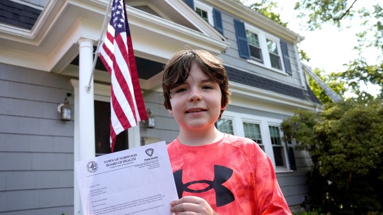 Danny Doherty, 12, of Norwood, Mass., stands for a photograph...