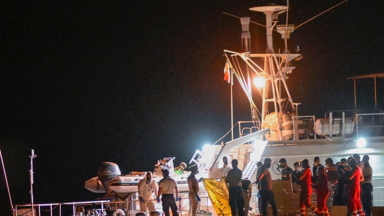 Italy's coast guard searches for dozens of migrants missing after their ...