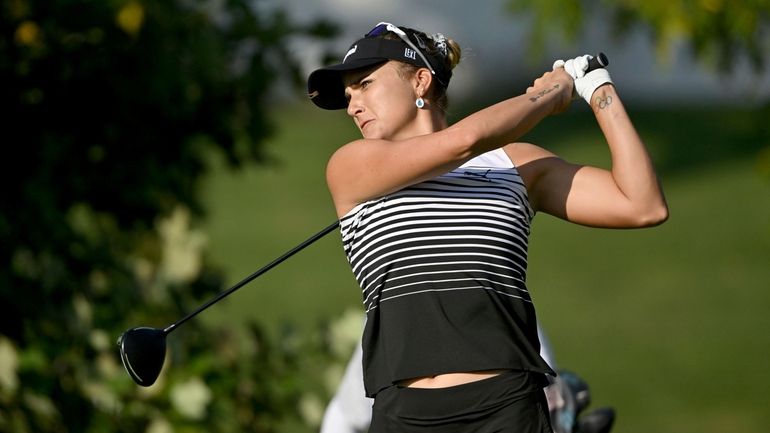 Lexi Thompson watches her tee shot on the fourth hole...