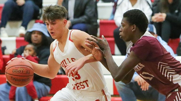 Half Hollow Hills West's Vince Corso (33) gets around Whitman's...