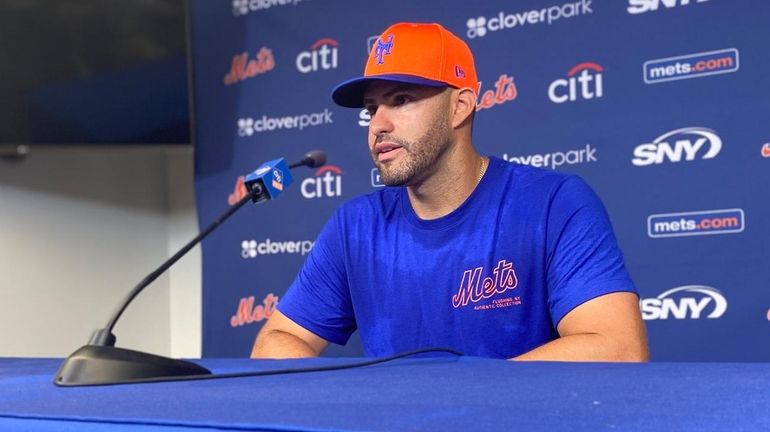 J.D. Martinez speaks at a news conference during Mets spring...