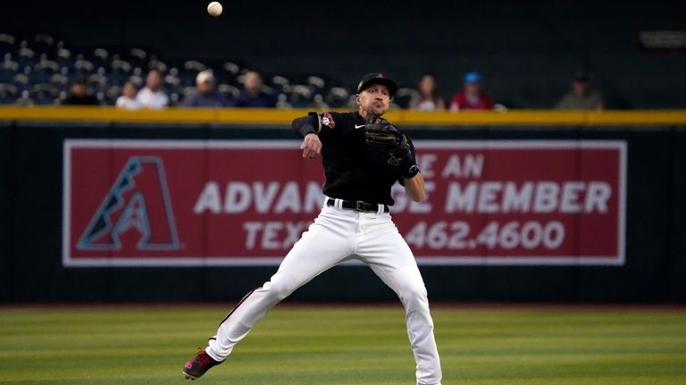 Walker's 459-foot blast helps D-backs beat Marlins 5-2