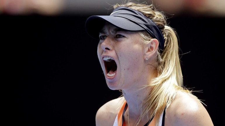 Maria Sharapova of Russia celebrates after winning a point against...