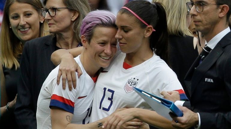 FILE - United States' Megan Rapinoe, left, and Alex Morgan...