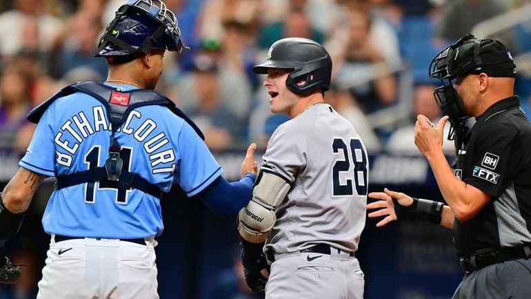 Christian Bethancourt #14 of the Tampa Bay Rays talks with...