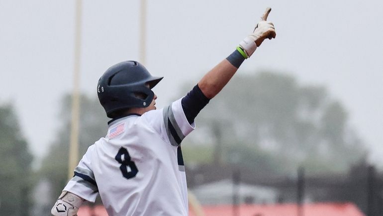 Plainview-Old Bethpage JFK’s Jake Gruttadauria rounds second after his homer in...