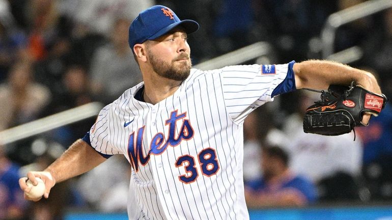 Mets starting pitcher Tylor Megill delivers against the Cincinnati Reds...