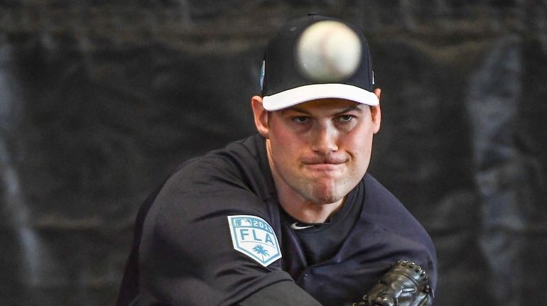 Yankees' Adam Ottavino pitches a bullpen session during spring training...