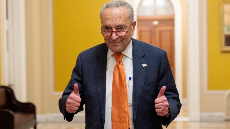 Senate Majority Leader Chuck Schumer, D-N.Y., gives two thumbs up...