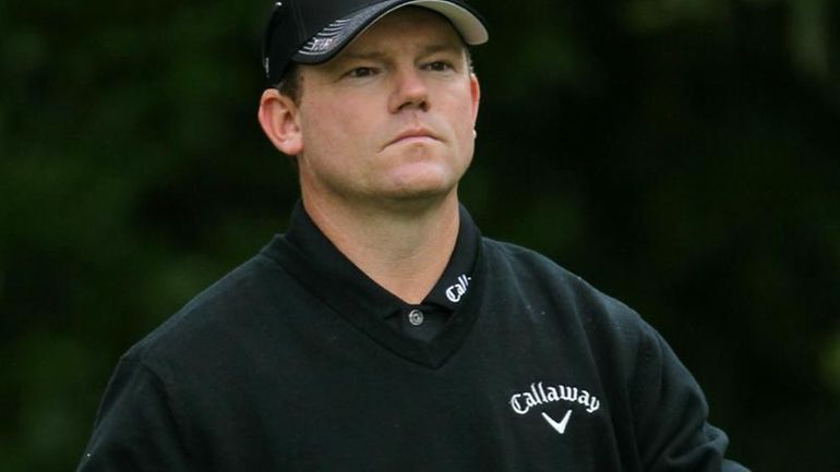 Shaun Micheel walks off the 16th tee during the second...