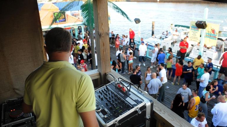 A DJ sets up to play music at Paddy McGees...