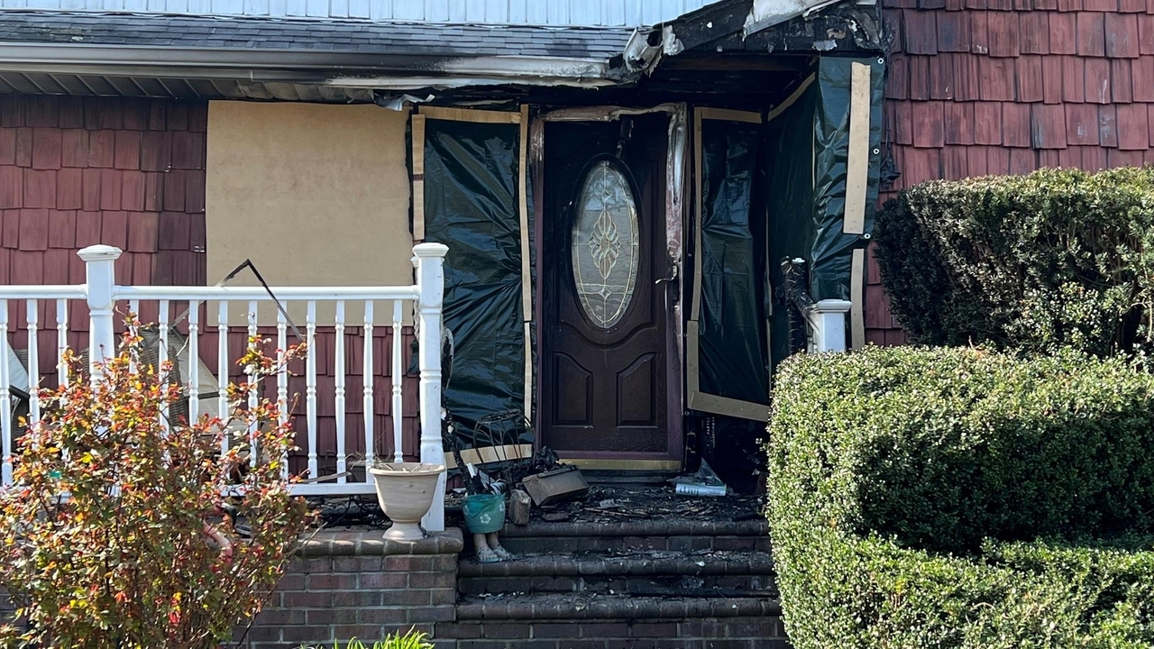 Cops: Officers rescue man from burning home - Newsday