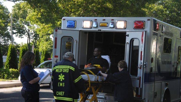 A student is tended to by paramedics after being struck...