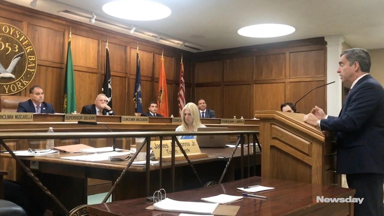 Oyster Bay supervisor halts town clerk speaking during public hearings