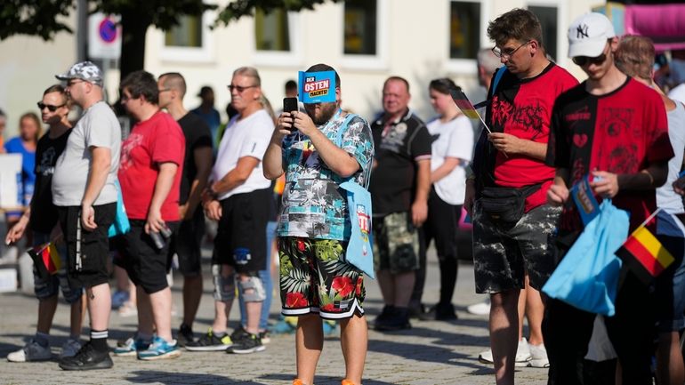 Supporters of the far-right Alternative for Germany, AfD, attend an...