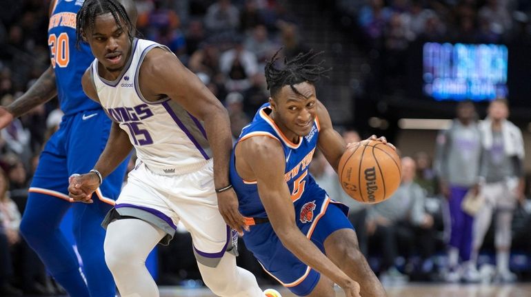 Knicks guard Immanuel Quickley (5) drives past Sacramento Kings guard...