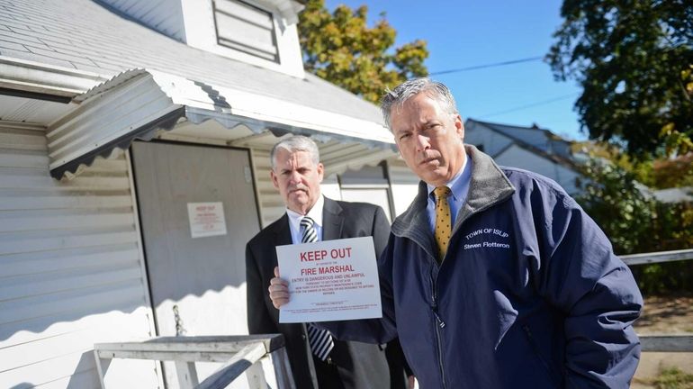 Islip Town Conuncilman Steven J. Flotteron, right, and Town of...