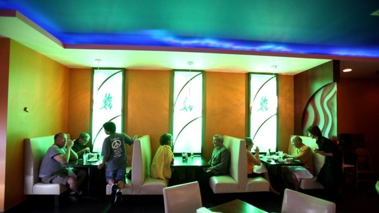 Domo Sushi is decorated in yellows, blues and greens. (June...