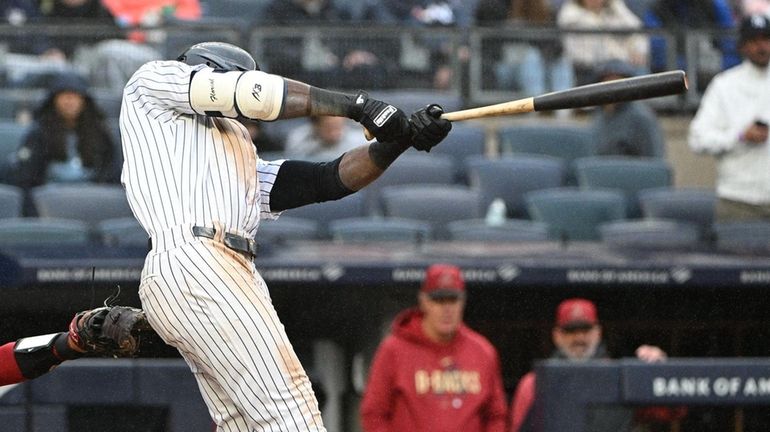 New York Yankees' Estevan Florial hits a sacrifice fly to...