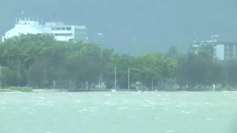 This image made from video show heavy seas in Cairns,...