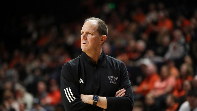 Washington head coach Mike Hopkins looks on during the first...