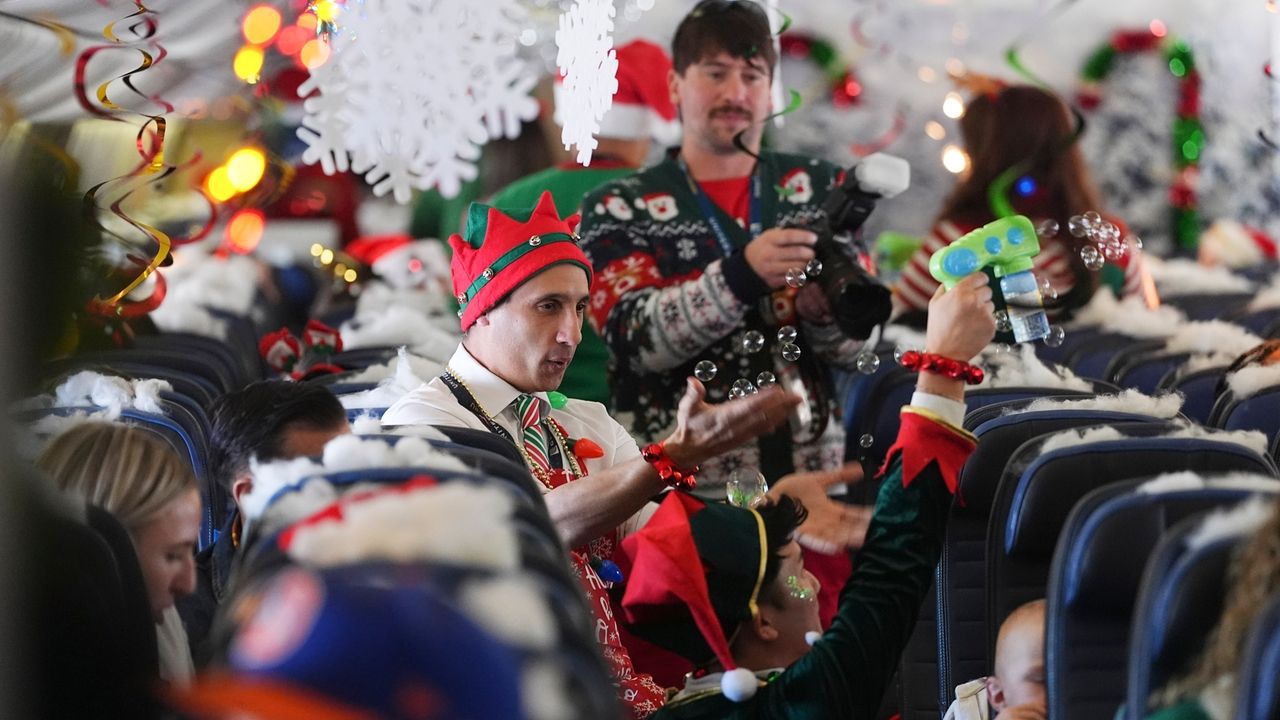 Flight takes kids to visit Santa at North Pole scene in transformed Denver airport hangar