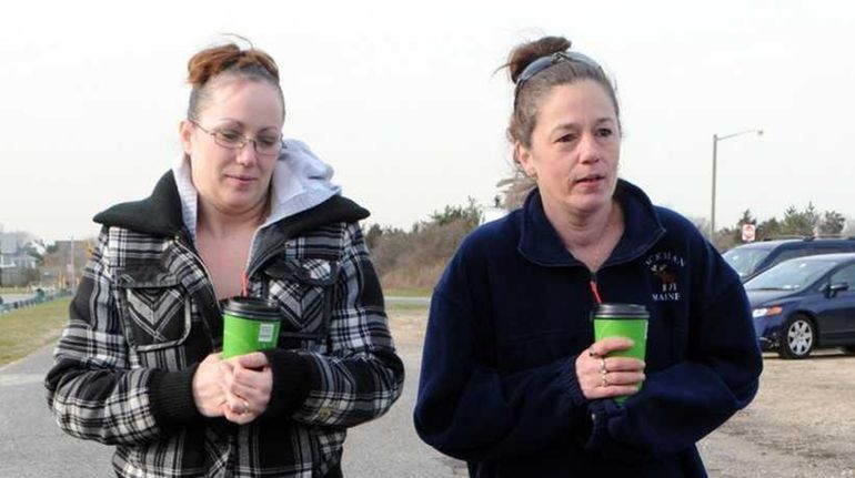 Melissa Cann, left, sister of Maureen Brainard-Barnes, and Lorraine Ela,...